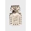 Bottle shaped brooch with logo