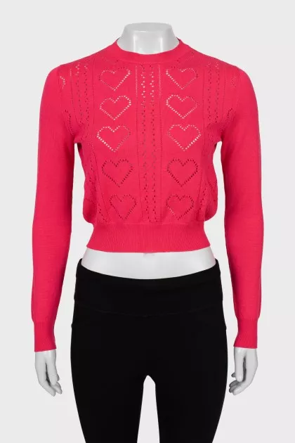 Pink jumper with perforated pattern
