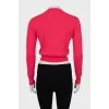Pink jumper with perforated pattern
