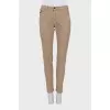 Men's beige skinny jeans with keychain