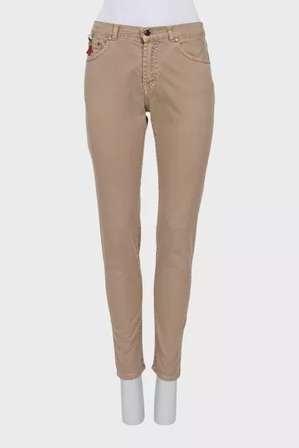 Men's beige skinny jeans with keychain