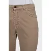 Men's beige skinny jeans with keychain