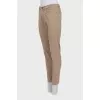 Men's beige skinny jeans with keychain