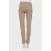 Men's beige skinny jeans with keychain