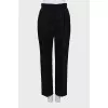 Woolen tapered trousers with creases