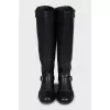 Leather boots decorated with a strap