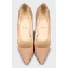 Beige patent leather pumps