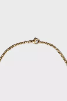 Golden pendant with a horse