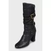 Leather boots with gold fittings