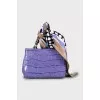 Crossbody bag decorated with a scarf