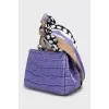 Crossbody bag decorated with a scarf
