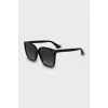 Black sunglasses with gold logo