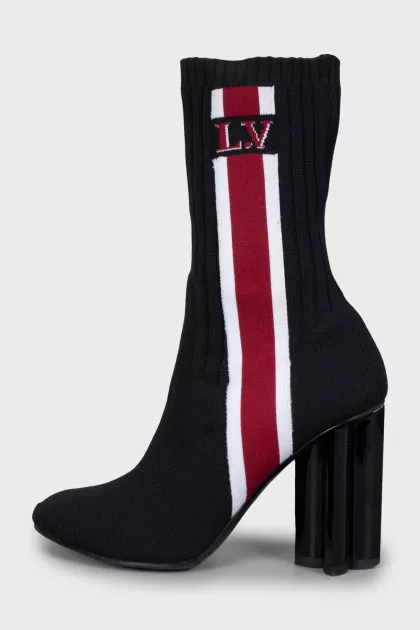 Textile ankle boots with a figured heel