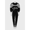 Knitted suit with relief seams