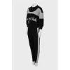 Knitted suit with relief seams