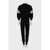 Knitted suit with relief seams