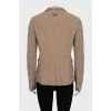 Fitted jacket with knitted sleeves