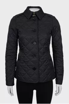 Black quilted jacket with tag