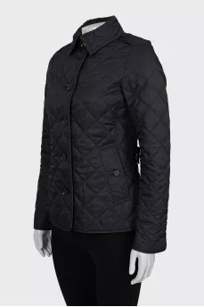 Black quilted jacket with tag