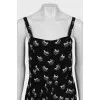 Jumpsuit with straps in the signature print