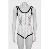 Perforated bodysuit with tag