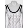 Perforated bodysuit with tag