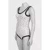 Perforated bodysuit with tag
