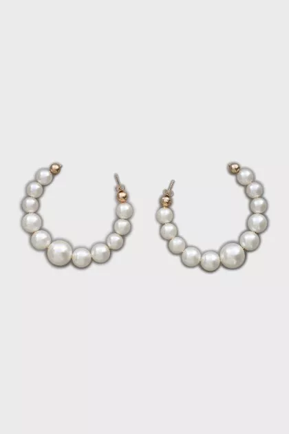 Massive earrings made of artificial pearls