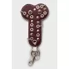 Keychain decorated with eyelets and spikes