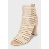 Ankle boots with heels and woven inserts