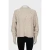 Beige sweater with textured pattern