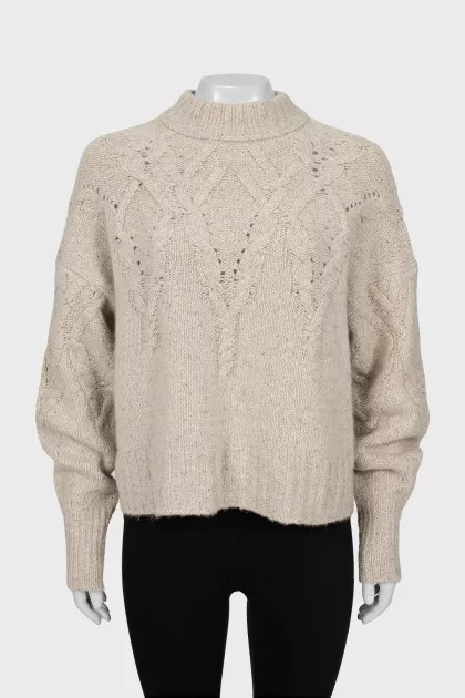Beige sweater with textured pattern