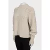 Beige sweater with textured pattern