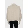 Beige sweater with textured pattern