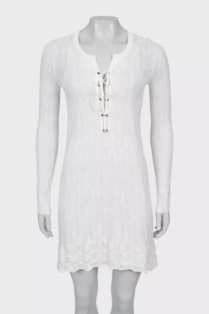 Knitted dress decorated with lacing