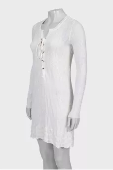 Knitted dress decorated with lacing