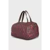 Eco-leather bag with a signature print