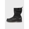 Leather boots decorated with straps