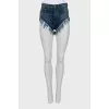 Cropped denim shorts with fringe