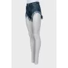 Cropped denim shorts with fringe