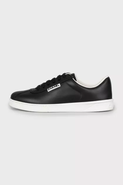 Black leather sneakers with brand logo