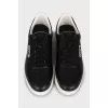 Black leather sneakers with brand logo