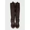 Leather boots decorated with straps