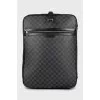 Suitcase made of canvas with a signature print