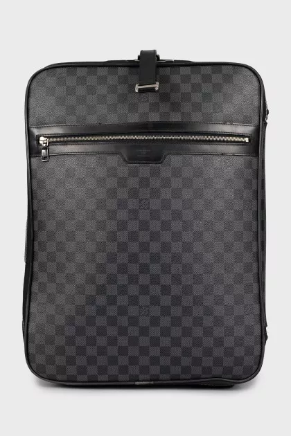 Suitcase made of canvas with a signature print