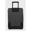Suitcase made of canvas with a signature print
