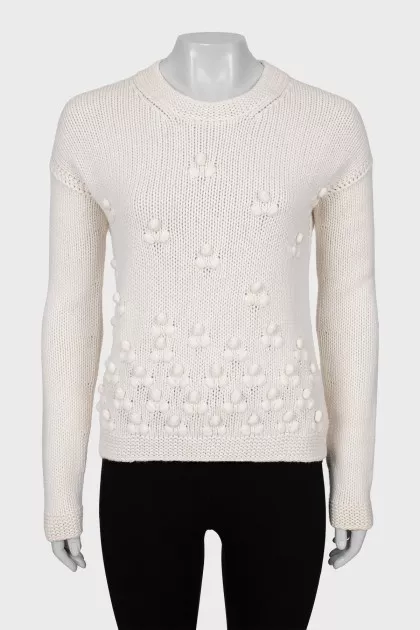 Knitted sweater with decorative embroidery