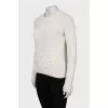Knitted sweater with decorative embroidery