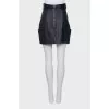 Leather skirt decorated with a bow