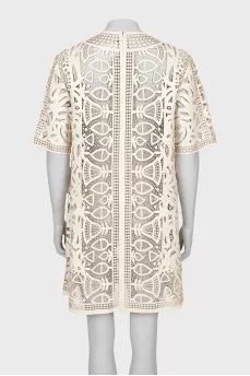 Perforated leather dress with tag